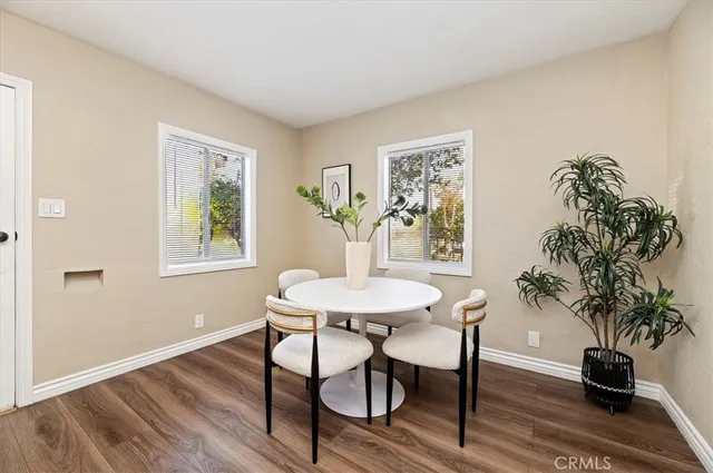 a view of a livingroom with furniture and a potted plant