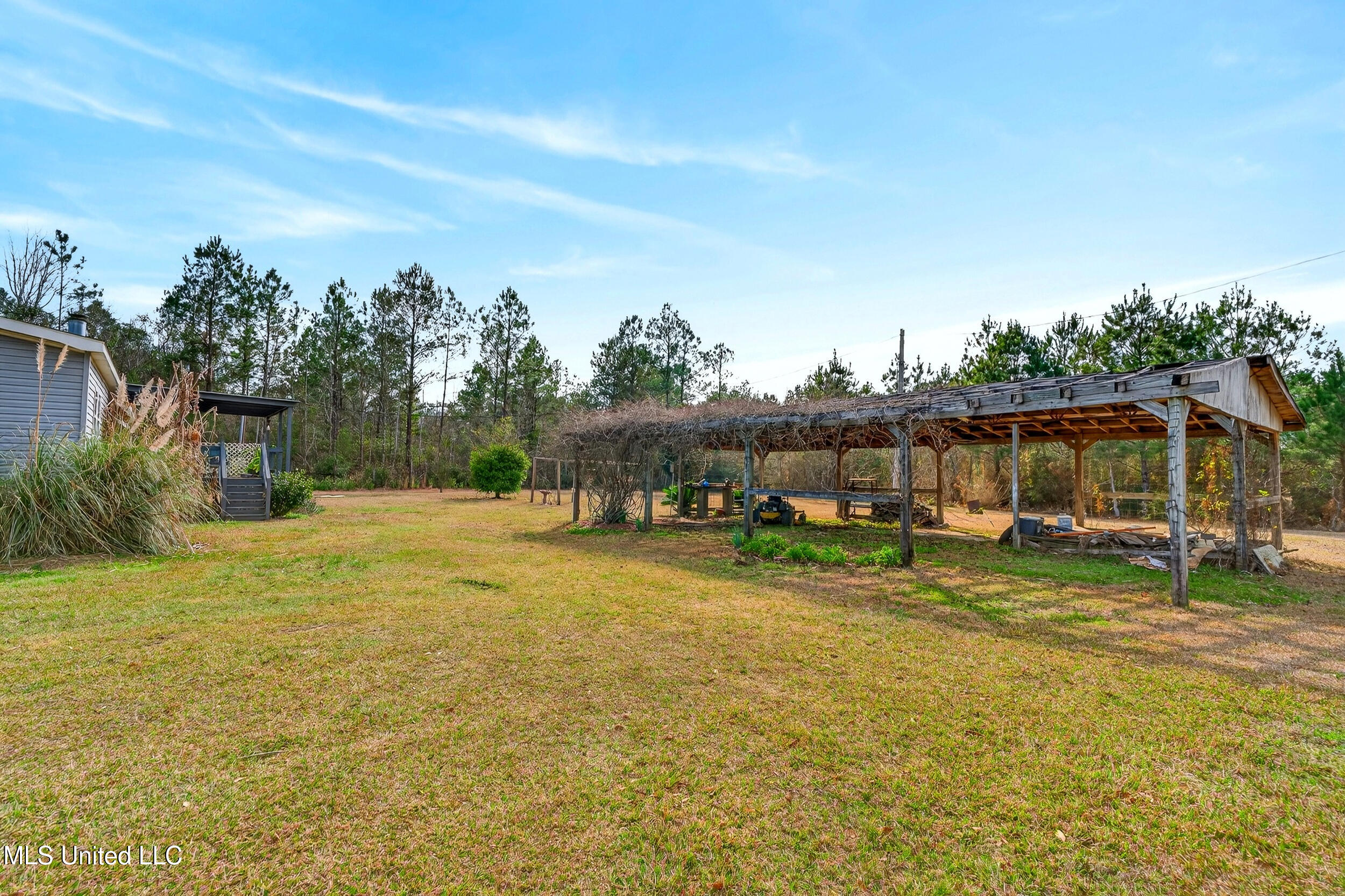 21041 Success Road Saucier, MS 39574 - Photo 48 of 59 48_side house backyard
