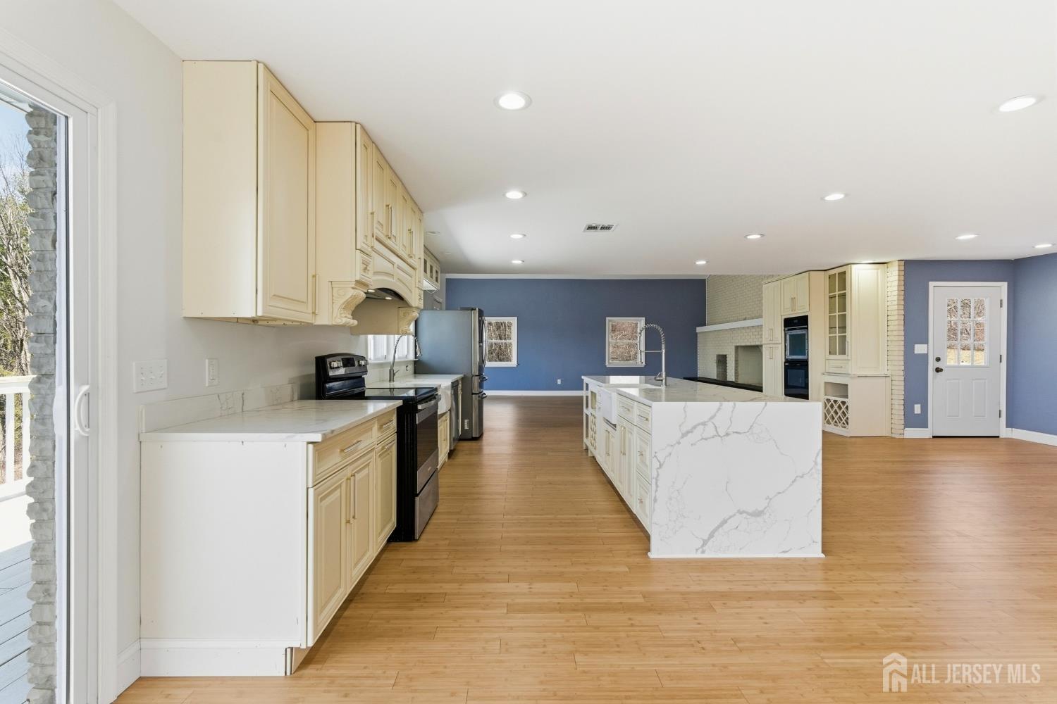 2 Rossi Drive Clinton, NJ 08809 - Photo 17 of 73 a large kitchen with stainless steel appliances granite countertop a large counter top a stove and a refrigerator