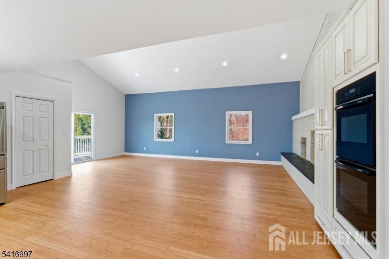 2 Rossi Drive Clinton, NJ 08809 - Photo 21 of 73 a view of an empty room with a kitchen and a window