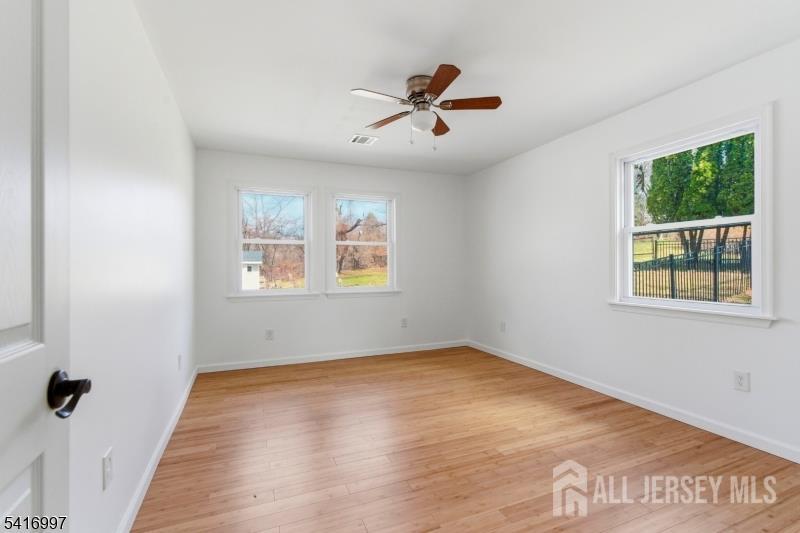 2 Rossi Drive Clinton, NJ 08809 - Photo 27 of 73 wooden floor in an empty room with a window