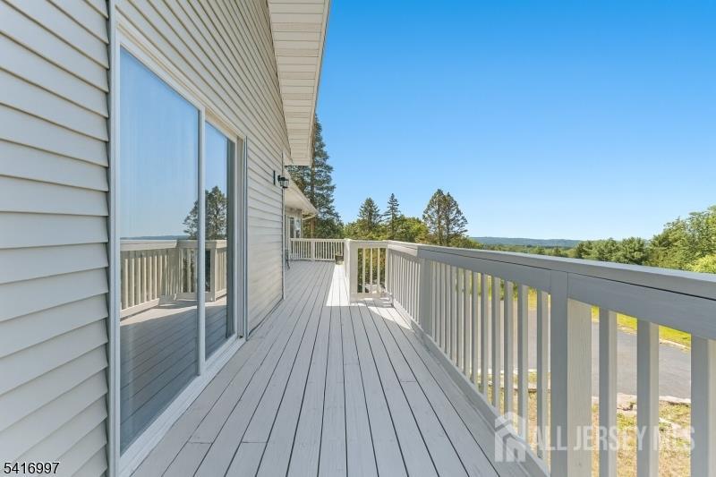 2 Rossi Drive Clinton, NJ 08809 - Photo 39 of 73 a view of a balcony with wooden floor and fence