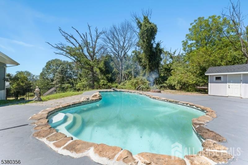 2 Rossi Drive Clinton, NJ 08809 - Photo 45 of 73 a view of a swimming pool with a yard