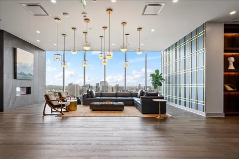 a view of living room with furniture and floor to ceiling window