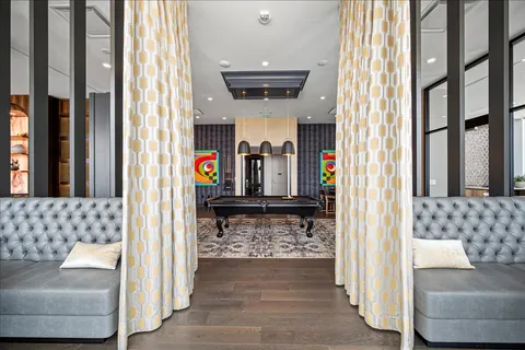 a view of living room filled with furniture and a large window