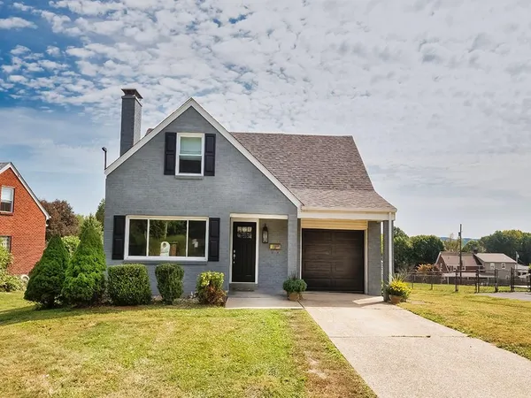 a house with swimming pool in front of it