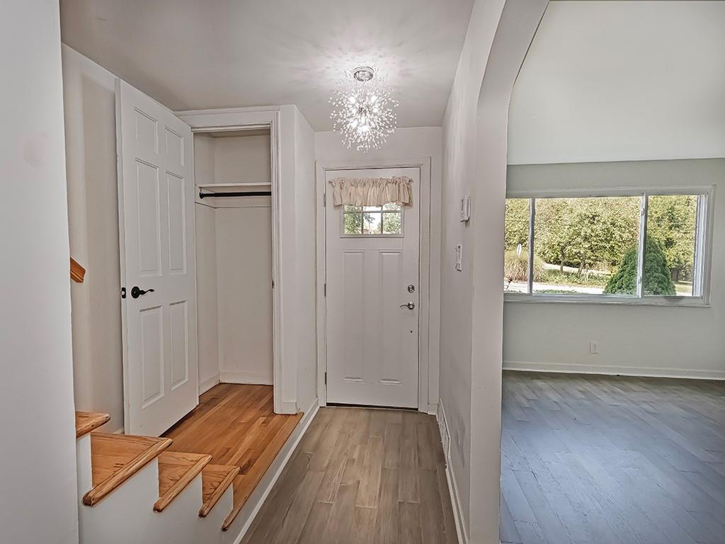305 Prospect Circle Lower Burrell, PA 15068 - Photo 13 of 29 wooden floor in an empty room with a window
