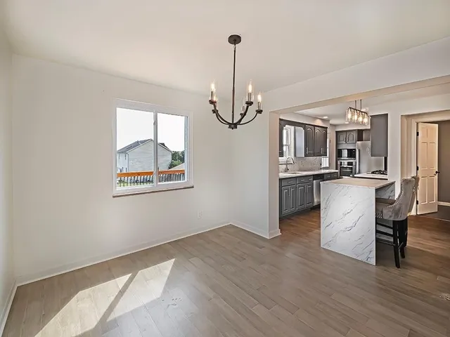 a view of a kitchen from the hallway