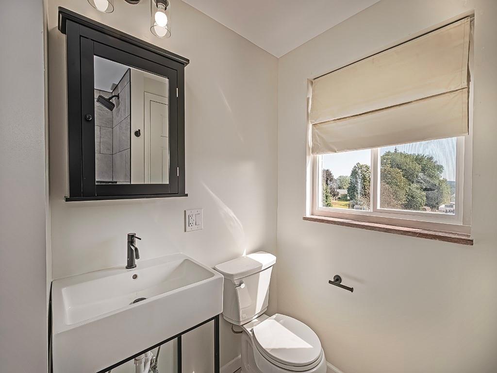 305 Prospect Circle Lower Burrell, PA 15068 - Photo 18 of 29 a bathroom with a toilet sink and mirror
