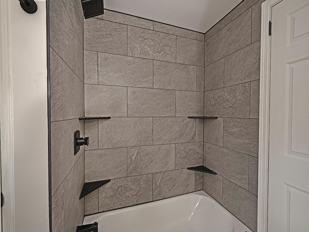 305 Prospect Circle Lower Burrell, PA 15068 - Photo 19 of 29 a bathroom with a shower and a bathtub