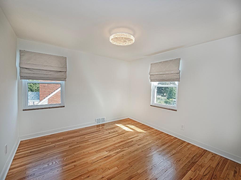305 Prospect Circle Lower Burrell, PA 15068 - Photo 23 of 29 a view of empty room with wooden floor and fan