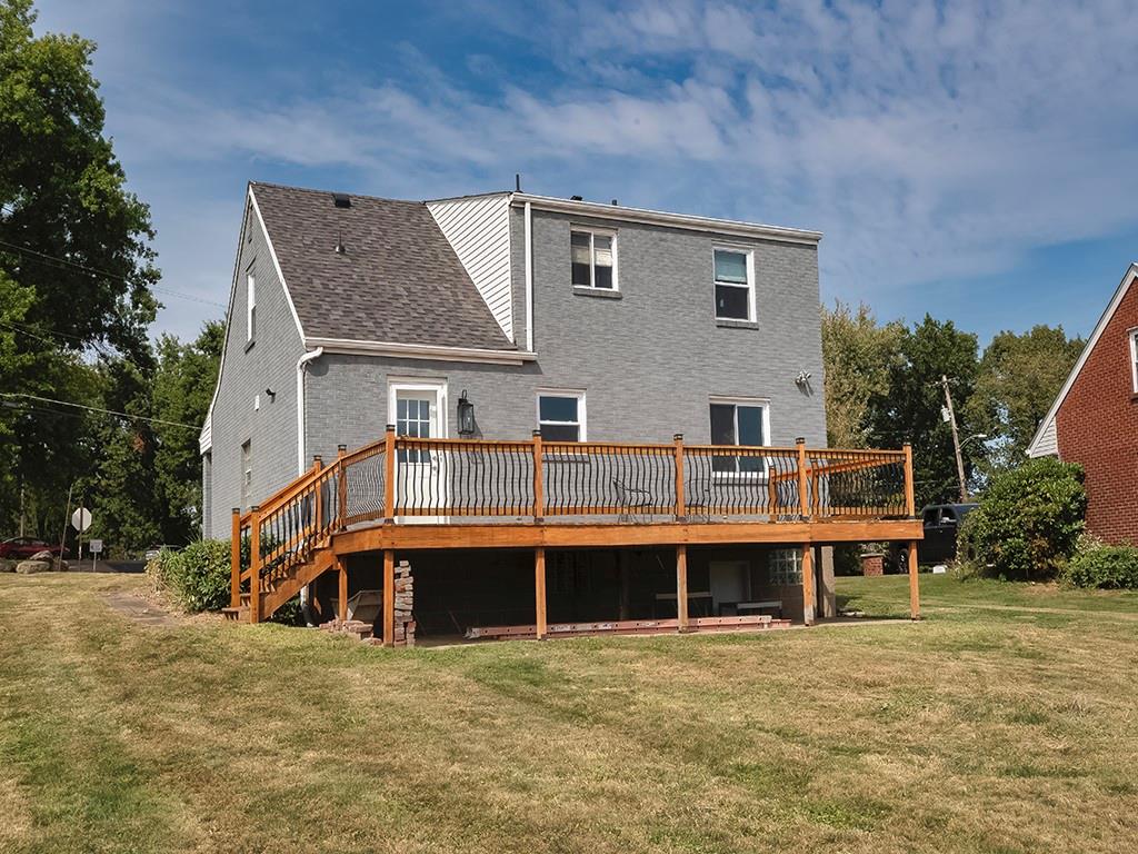 305 Prospect Circle Lower Burrell, PA 15068 - Photo 28 of 29 a front view of a house with a yard and garage