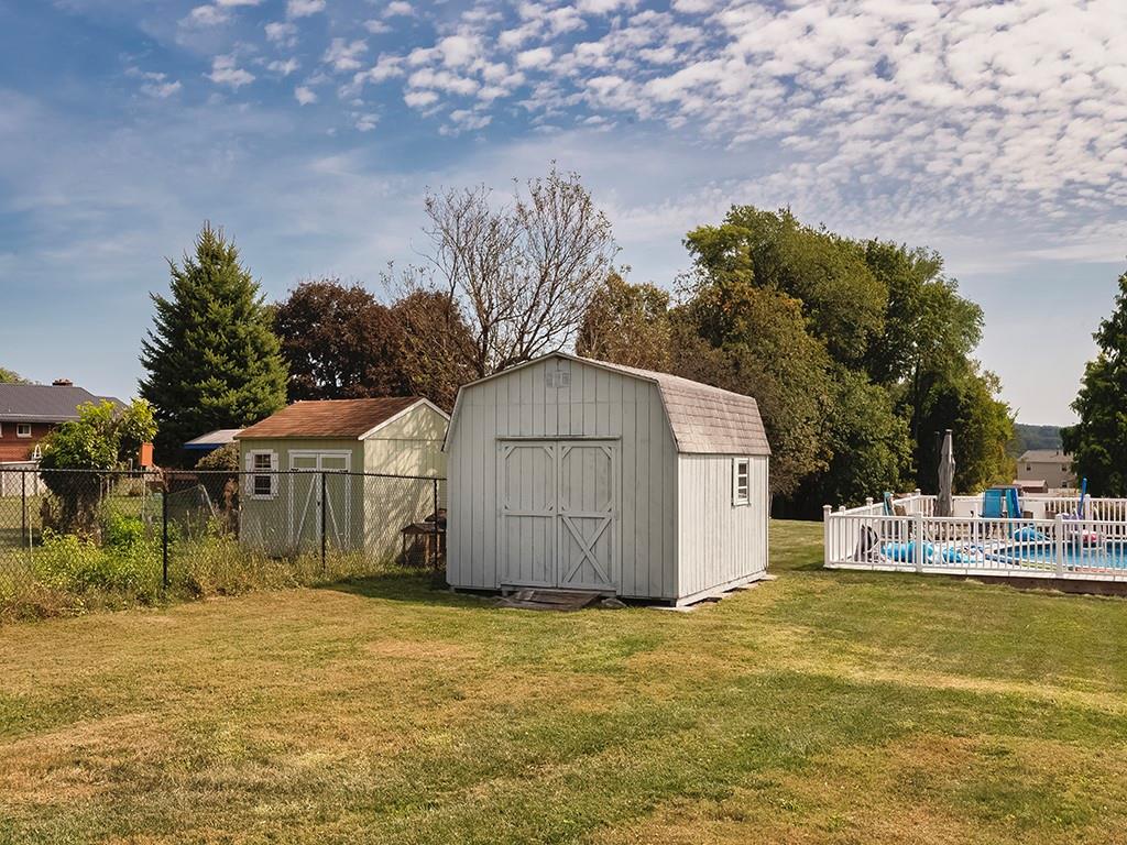 305 Prospect Circle Lower Burrell, PA 15068 - Photo 29 of 29 a backyard of a house with table and chairs