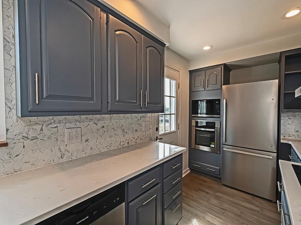 305 Prospect Circle Lower Burrell, PA 15068 - Photo 4 of 29 a kitchen with a refrigerator and a sink