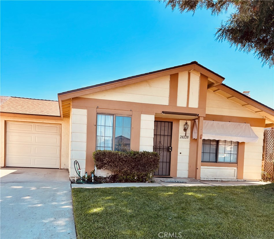28228 Corte Retiro Menifee, CA 92586 - Photo 1 of 1 a front view of a house with a yard