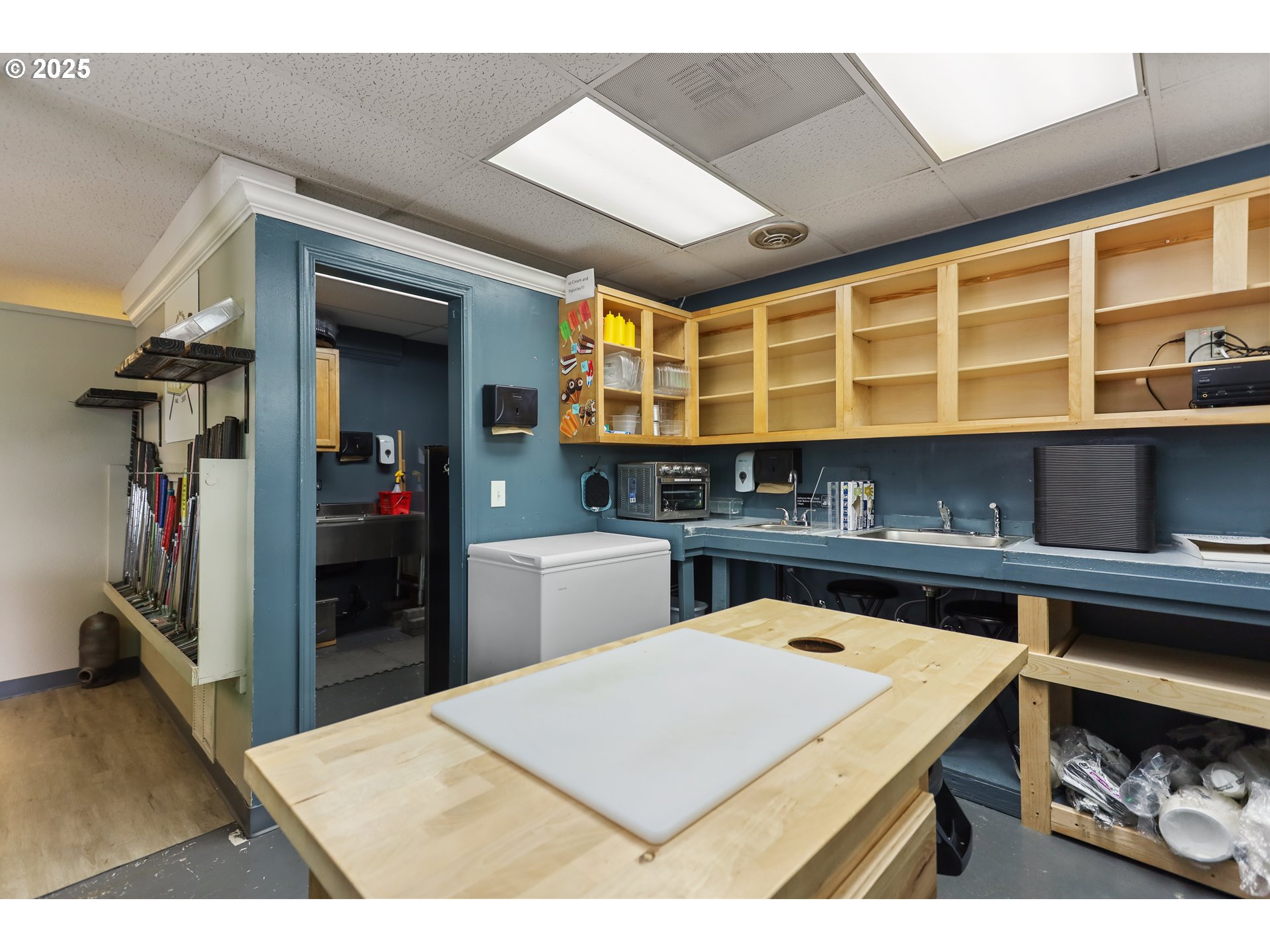 2718 East 2nd Street The Dalles, OR 97058 - Photo 27 of 45 a kitchen with a refrigerator and a sink