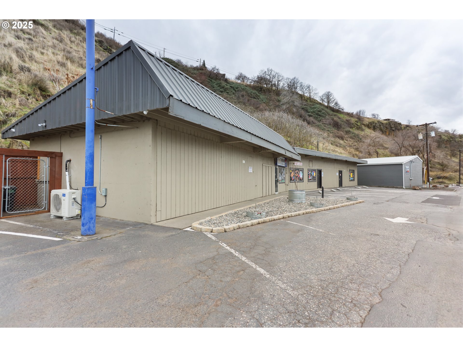 2718 East 2nd Street The Dalles, OR 97058 - Photo 3 of 45 a house with trees in the background