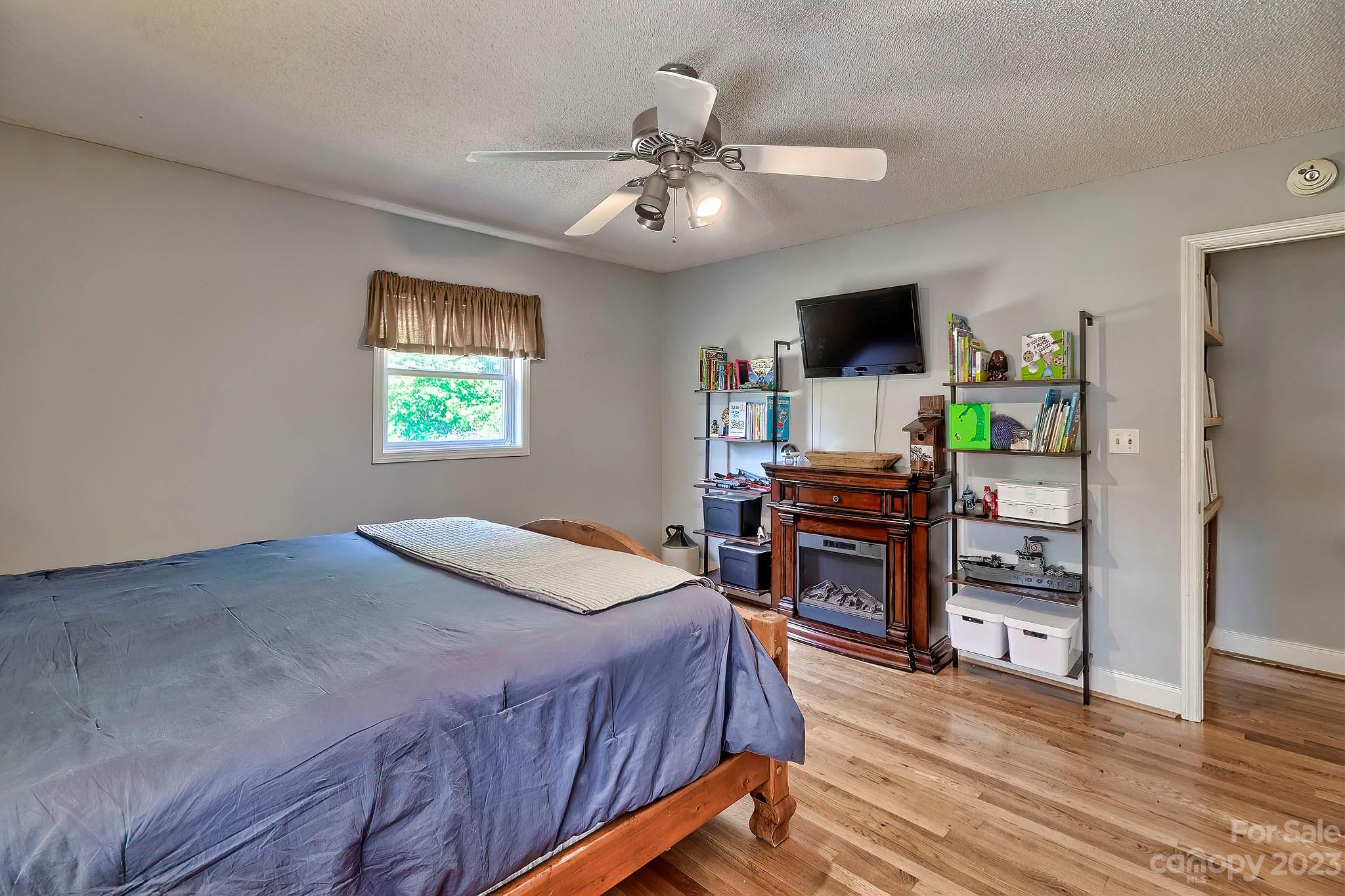 1880 Jones Road Kershaw, SC 29067 - Photo 14 of 33 a bedroom with a bed and a flat screen tv