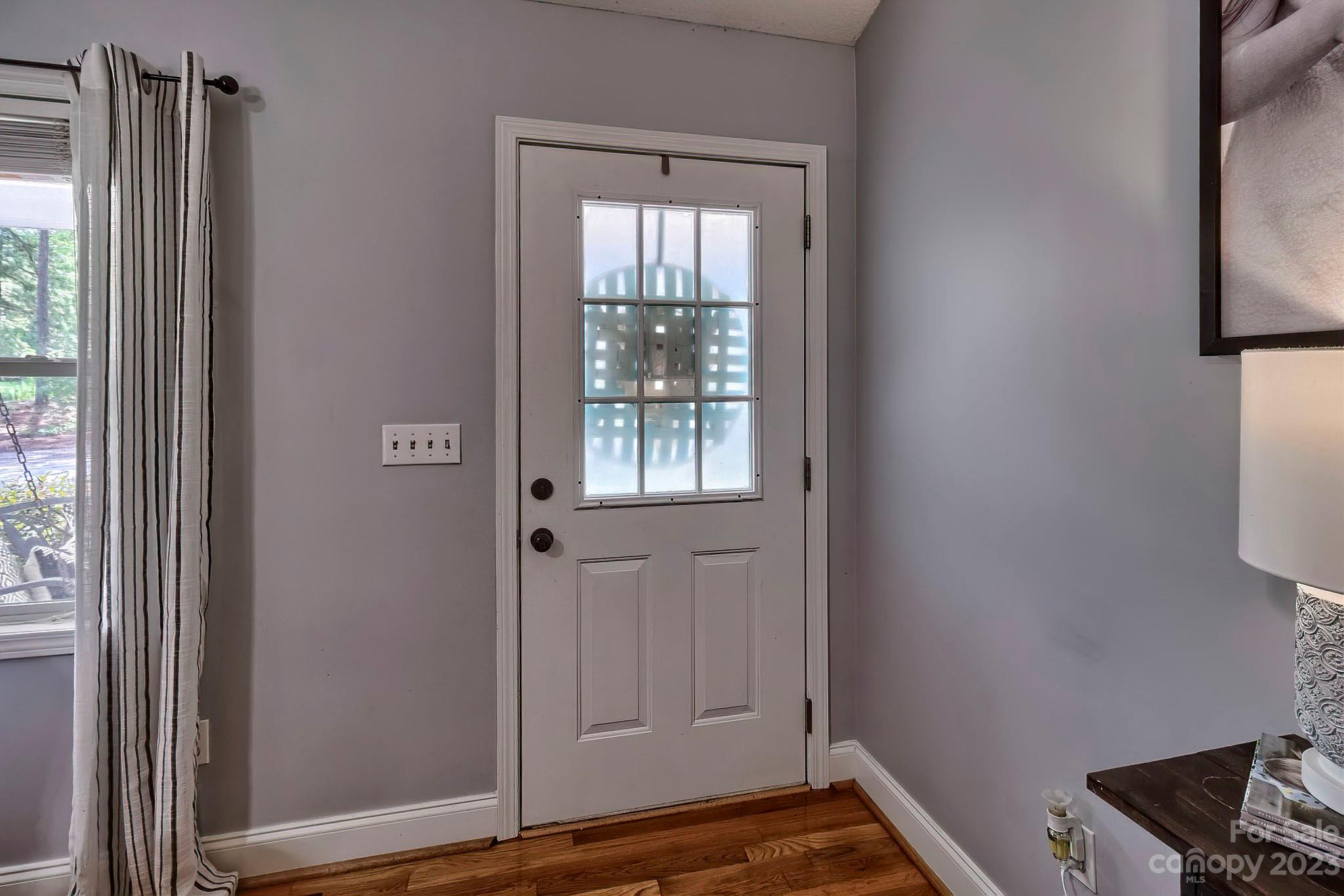 1880 Jones Road Kershaw, SC 29067 - Photo 16 of 33 a view of an empty room with wooden floor and a window