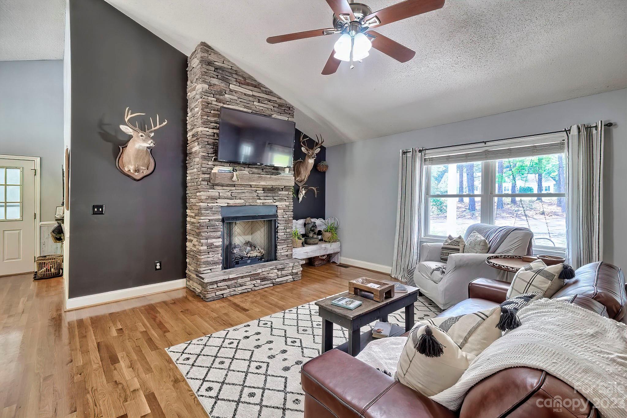 1880 Jones Road Kershaw, SC 29067 - Photo 19 of 33 a living room with furniture and a fireplace