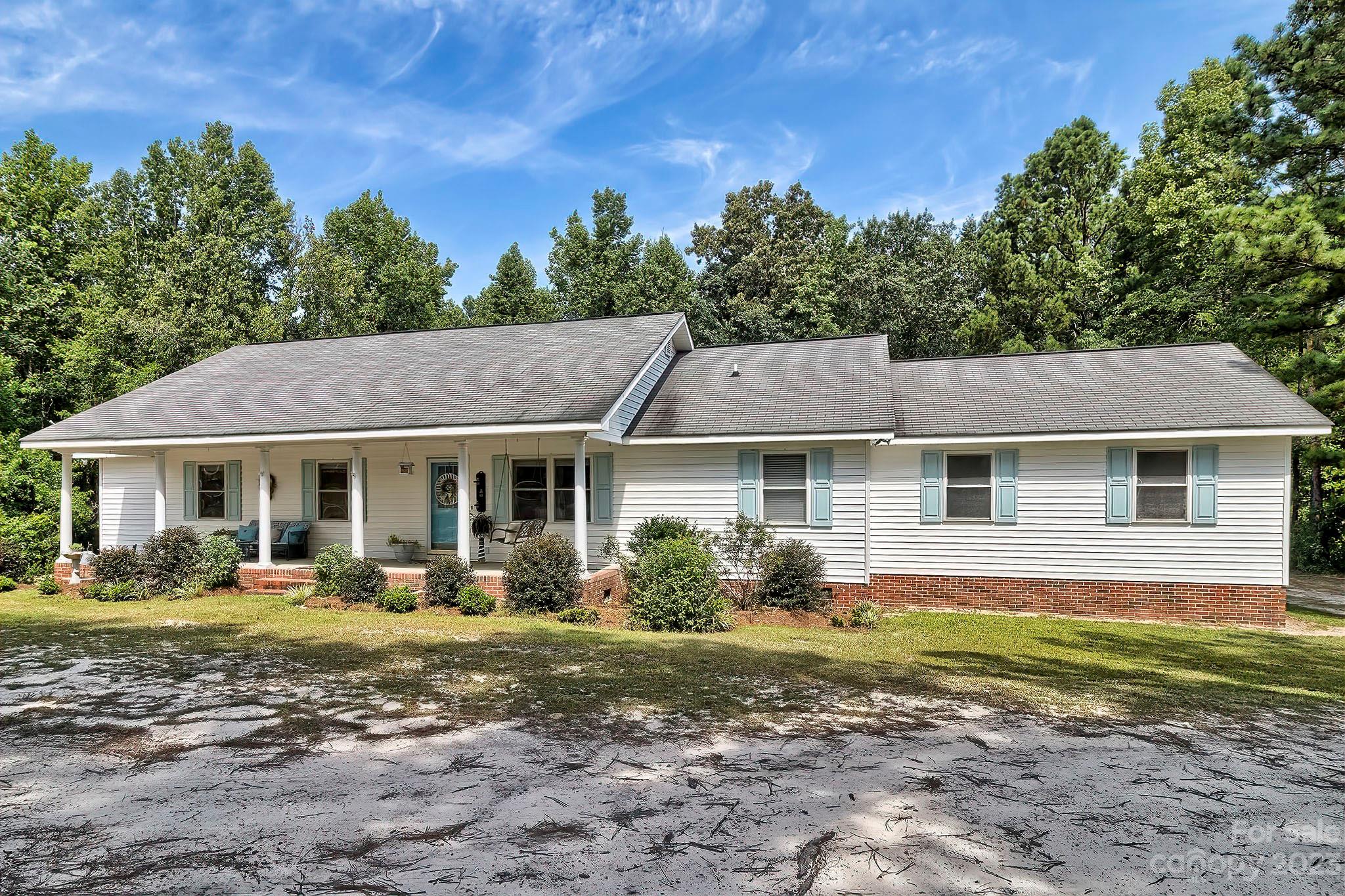 1880 Jones Road Kershaw, SC 29067 - Photo 24 of 33 a front view of a house with a garden