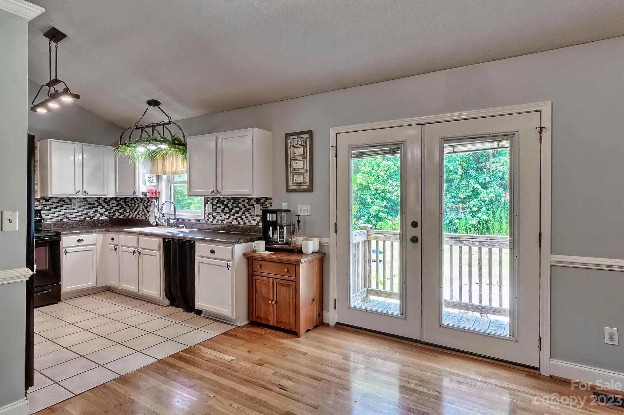 1880 Jones Road Kershaw, SC 29067 - Photo 27 of 33 a kitchen with a stove a sink and wooden floor