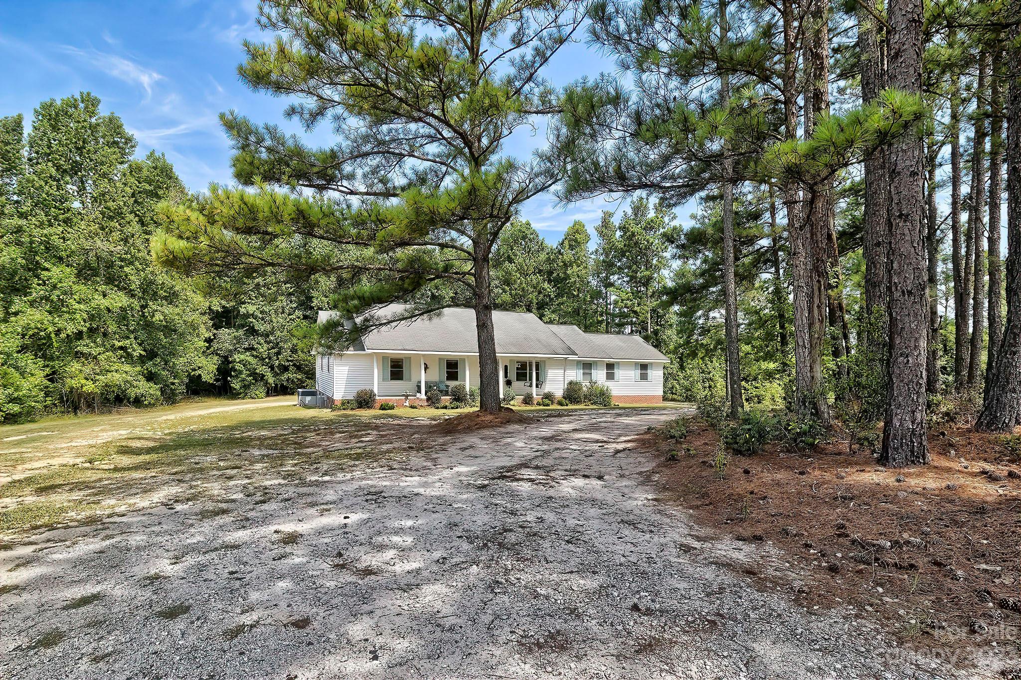 1880 Jones Road Kershaw, SC 29067 - Photo 31 of 33 a big house with large trees and a big yard