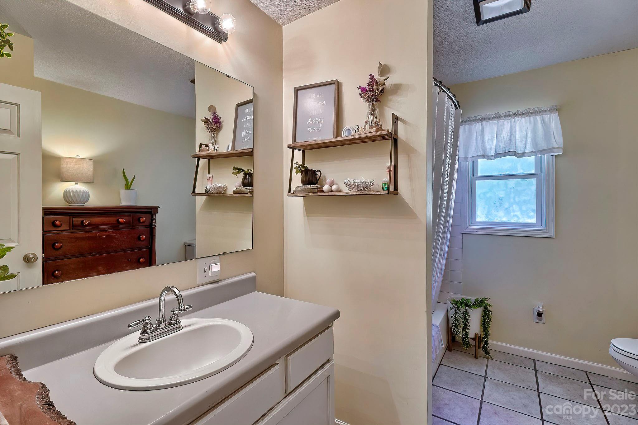 1880 Jones Road Kershaw, SC 29067 - Photo 32 of 33 a bathroom with a sink and a mirror