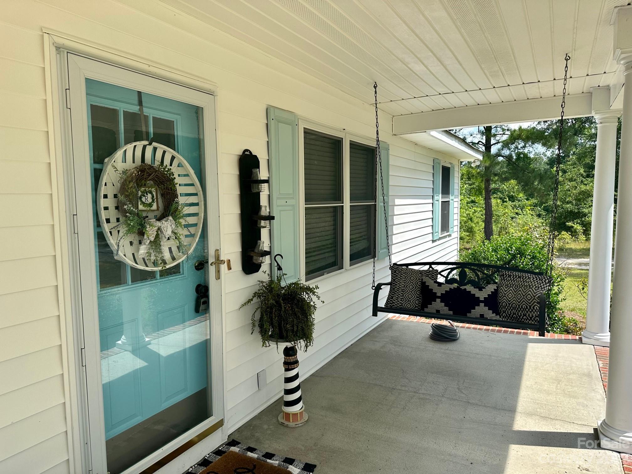 1880 Jones Road Kershaw, SC 29067 - Photo 4 of 33 a swimming pool with outdoor seating and yard
