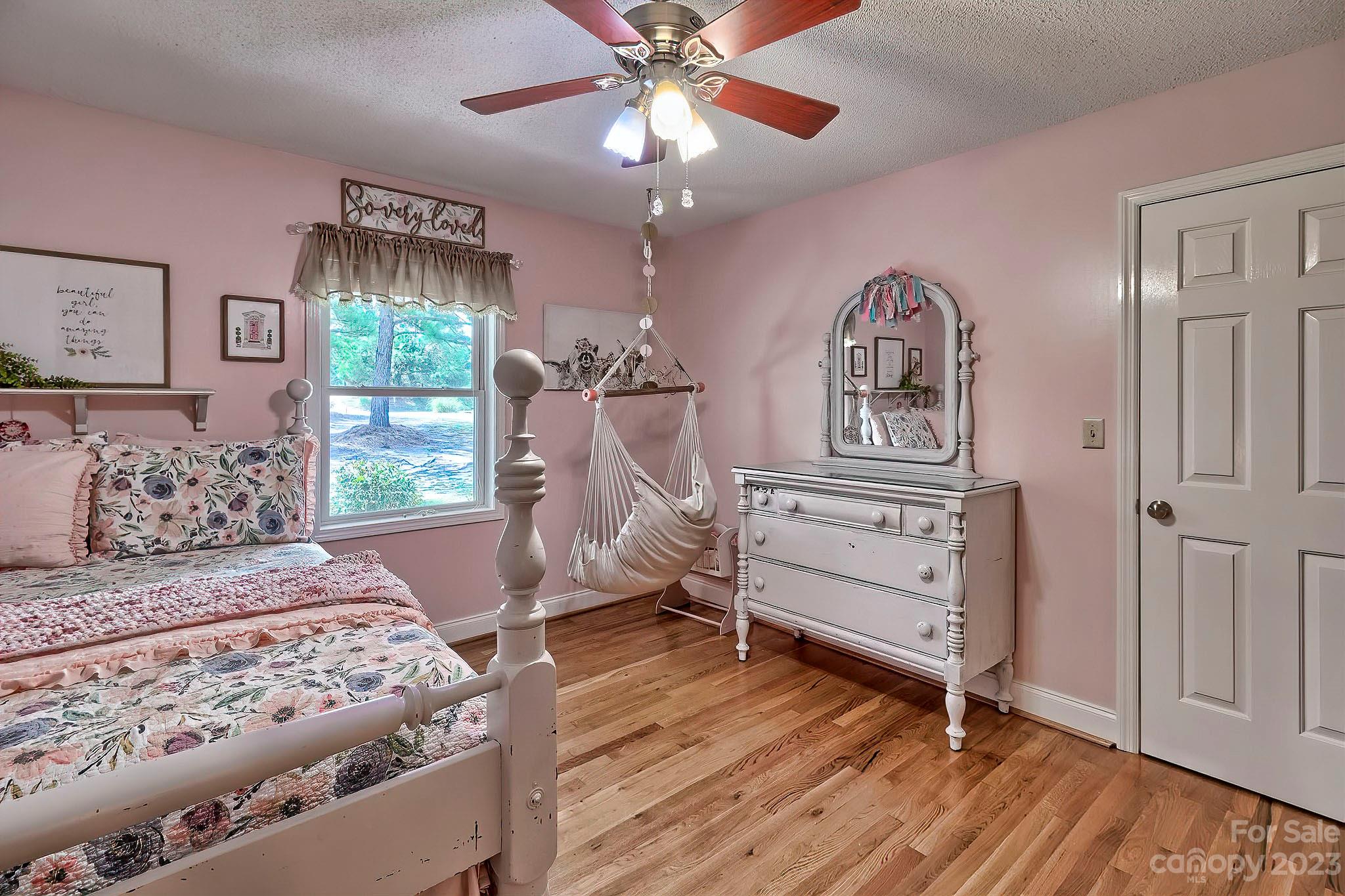 1880 Jones Road Kershaw, SC 29067 - Photo 6 of 33 a bedroom with a bed and a chandelier