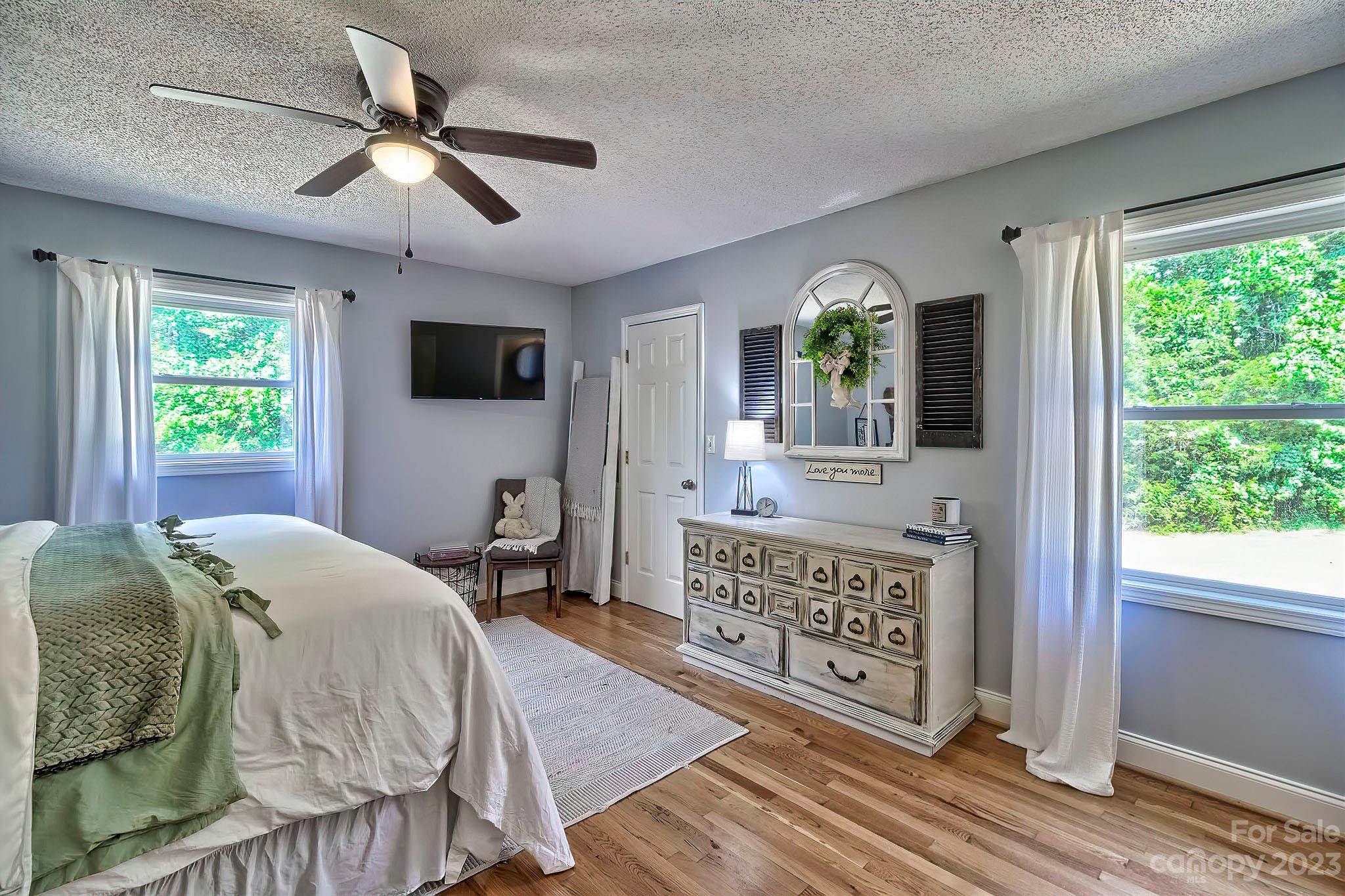 1880 Jones Road Kershaw, SC 29067 - Photo 7 of 33 a bedroom with a bed a mirror on the dresser and a window