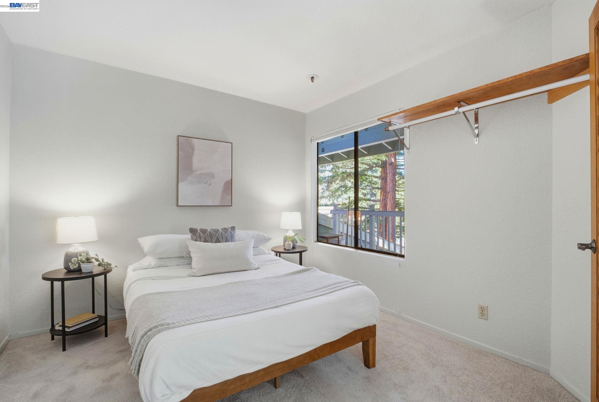 3395 Pinewood Terrace, Unit 304 Fremont, CA 94536 - Photo 16 of 33 a bedroom with a bed and a window