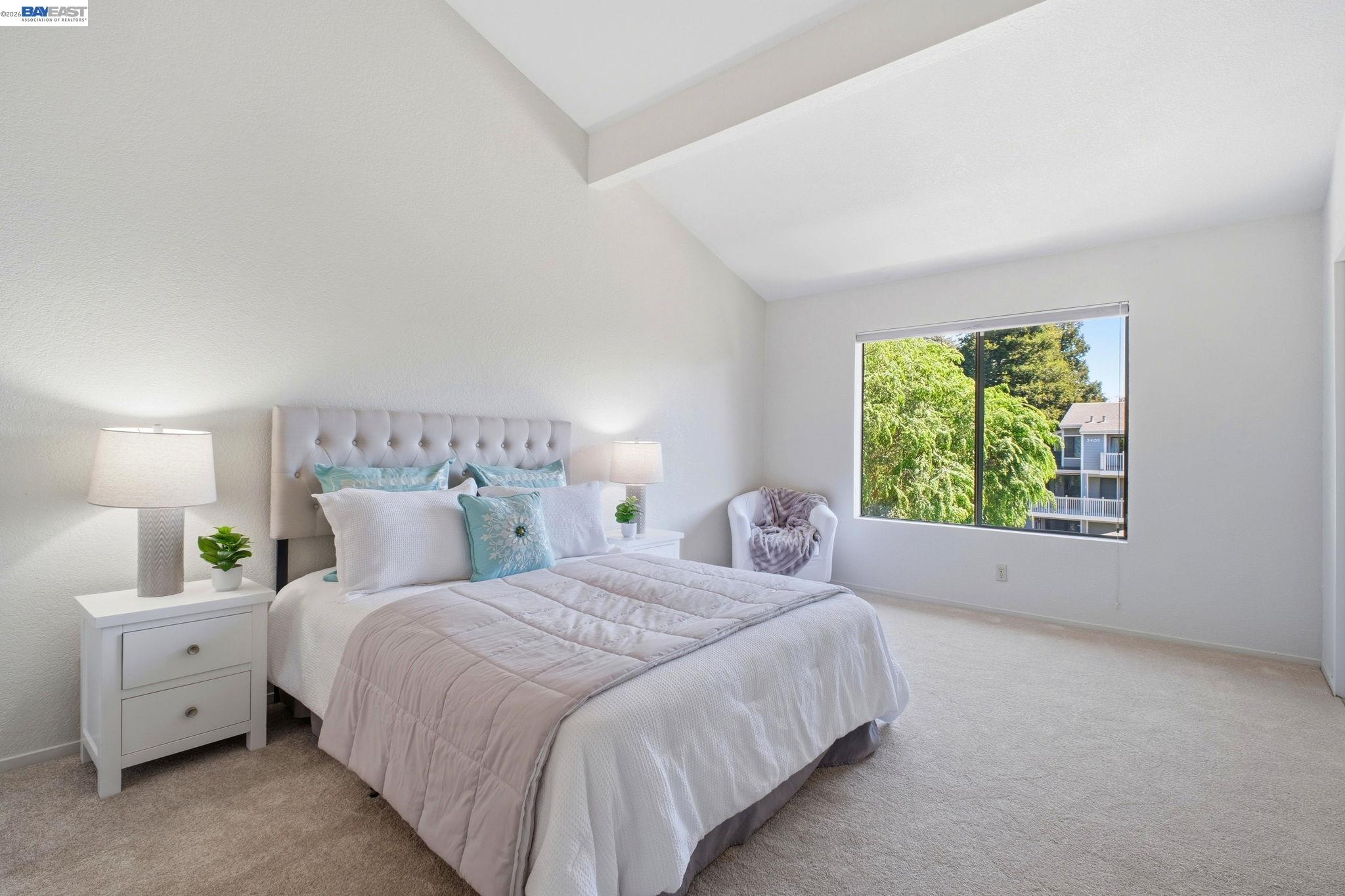 3395 Pinewood Terrace, Unit 304 Fremont, CA 94536 - Photo 22 of 33 a bedroom with a large bed and a large window