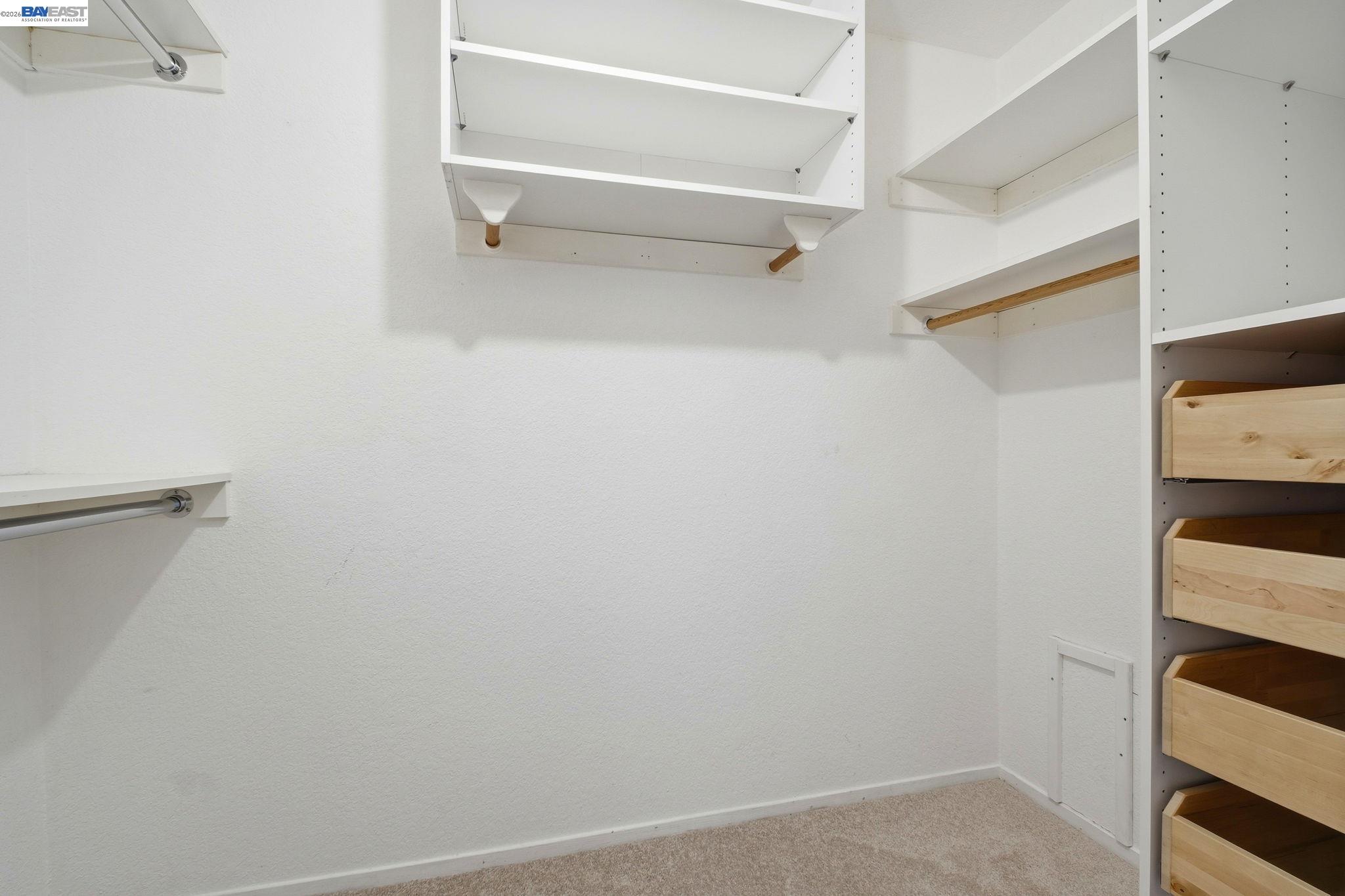 3395 Pinewood Terrace, Unit 304 Fremont, CA 94536 - Photo 23 of 33 a view of walk in closet with empty racks