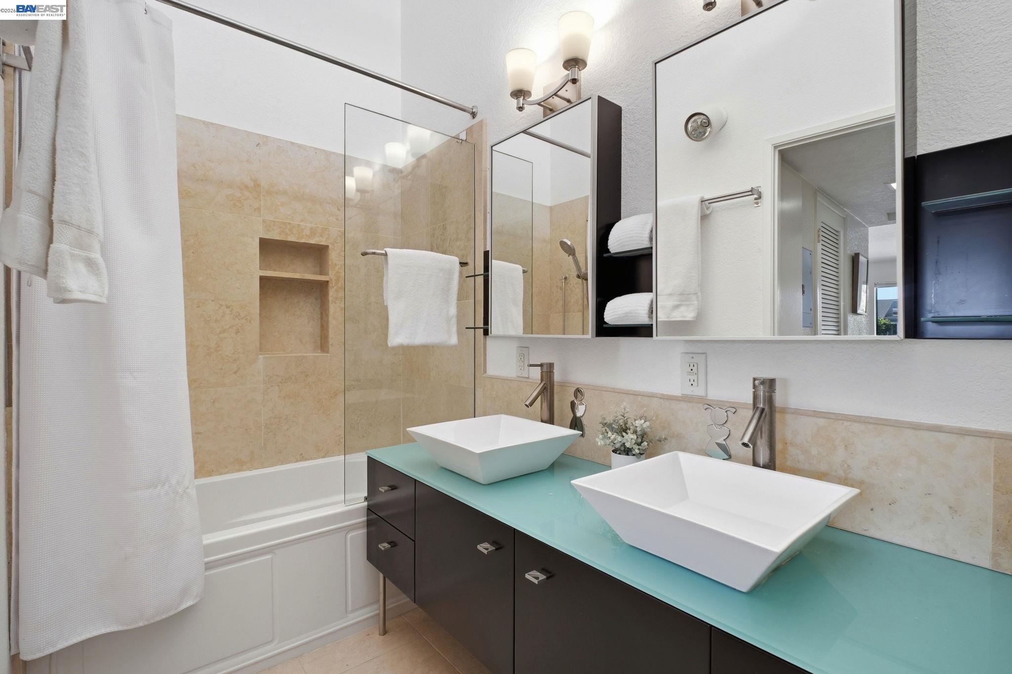 3395 Pinewood Terrace, Unit 304 Fremont, CA 94536 - Photo 24 of 33 a bathroom with a sink a shower and a mirror