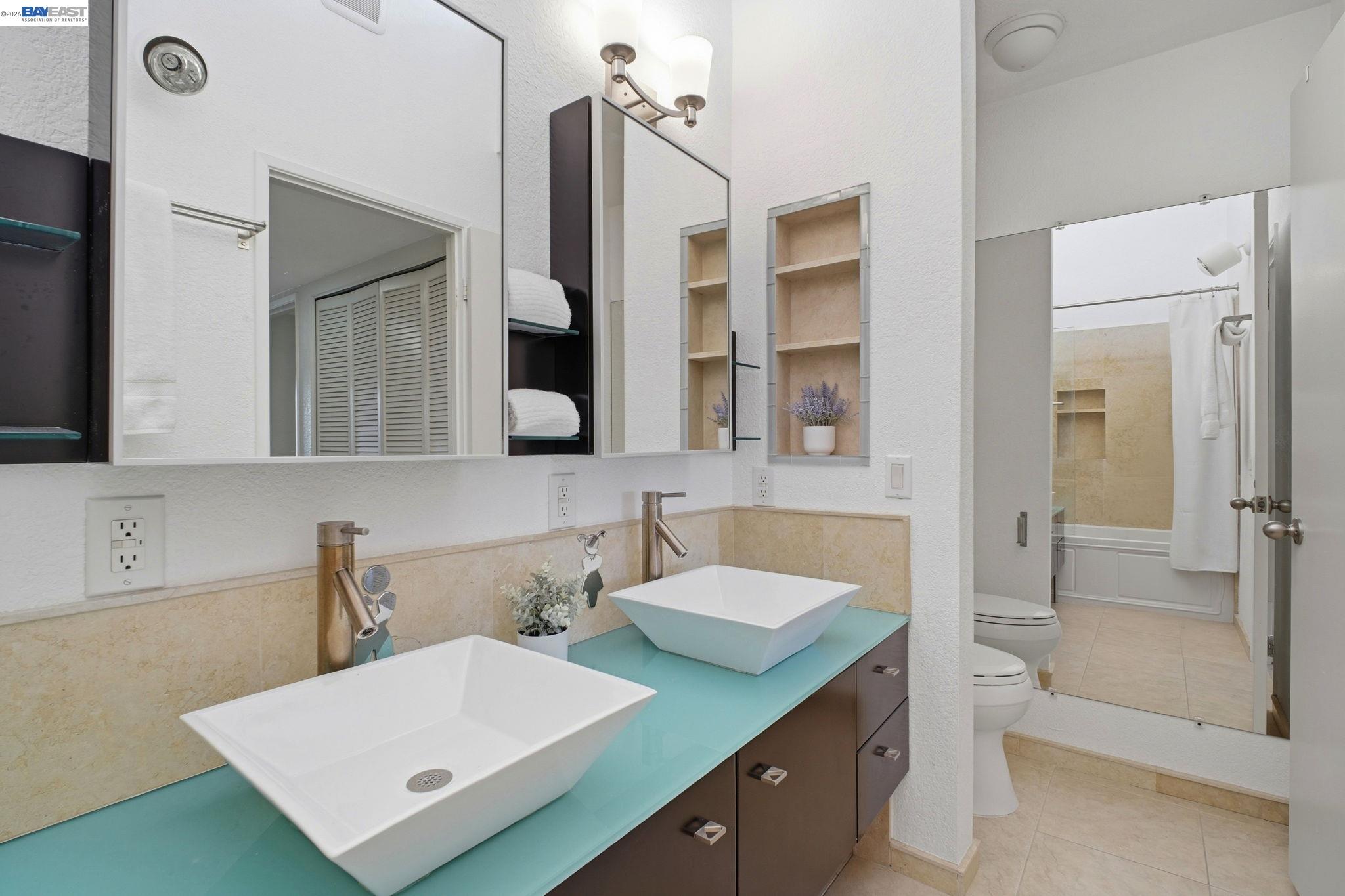 3395 Pinewood Terrace, Unit 304 Fremont, CA 94536 - Photo 25 of 33 a bathroom with a double vanity sink mirror and shower