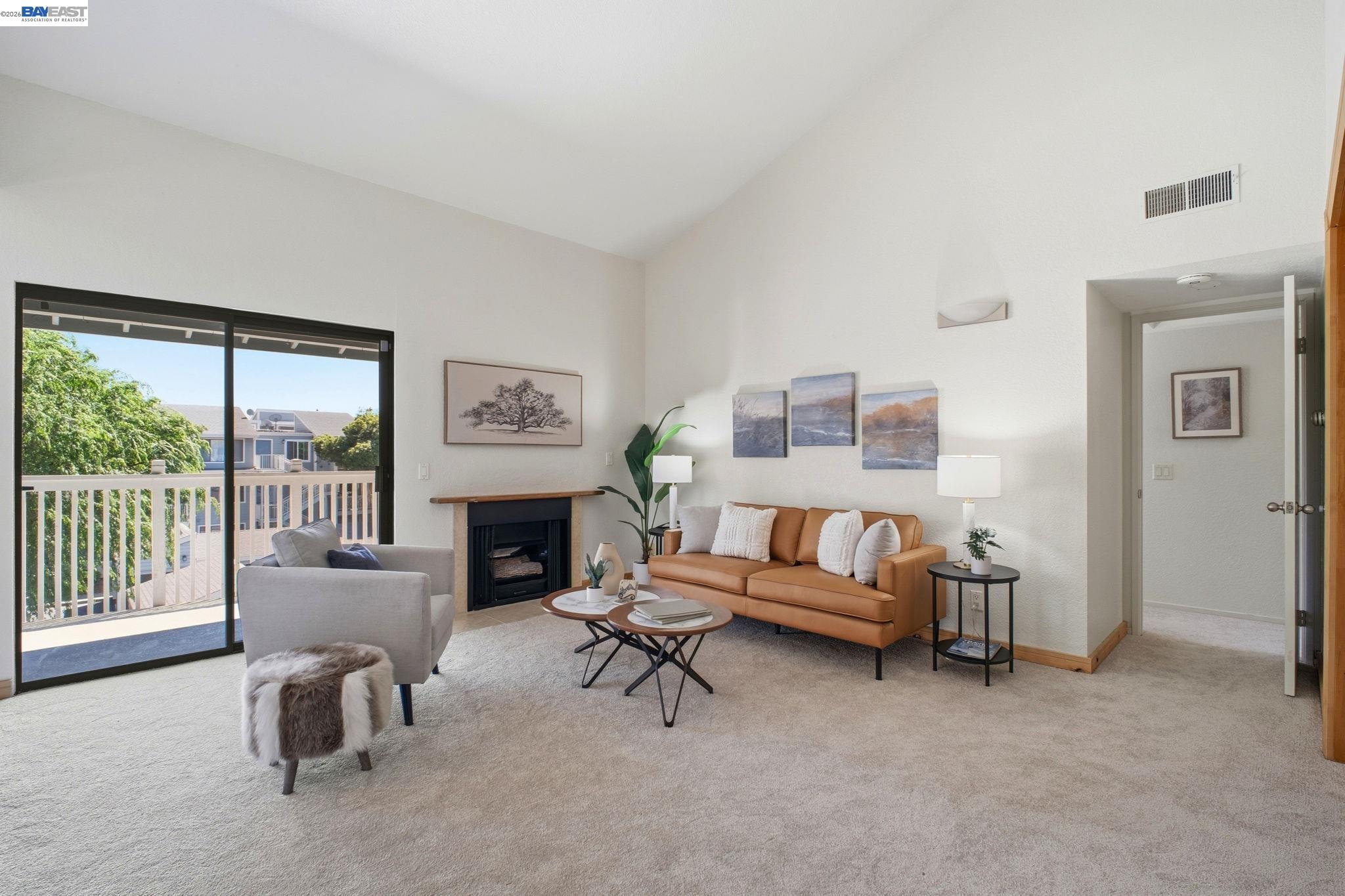 3395 Pinewood Terrace, Unit 304 Fremont, CA 94536 - Photo 5 of 33 a living room with furniture and a fireplace