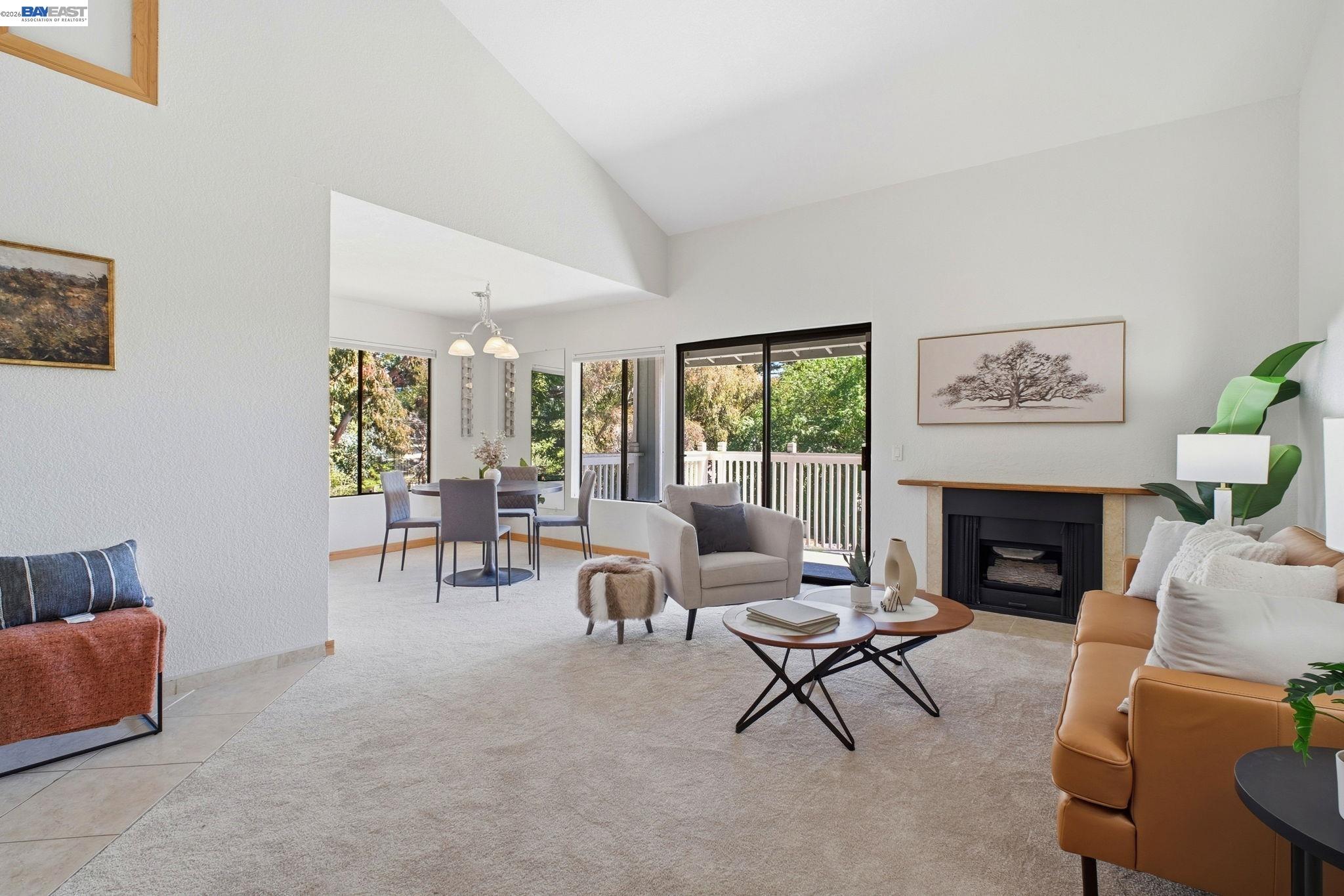 3395 Pinewood Terrace, Unit 304 Fremont, CA 94536 - Photo 6 of 33 a living room with furniture and a fireplace