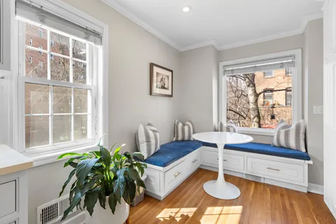 a living room with a large window and table