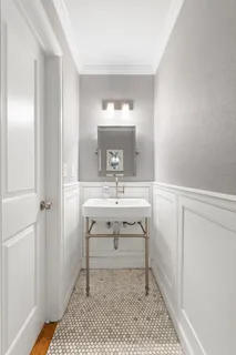 a bathroom with a sink a mirror and a vanity