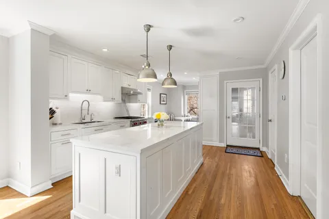 a large kitchen with sink and dishwasher