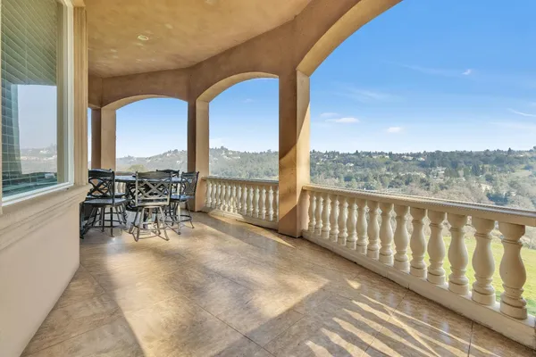 a large kitchen with a table and chairs