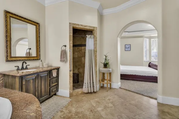 a bedroom with a bed wooden floor and window