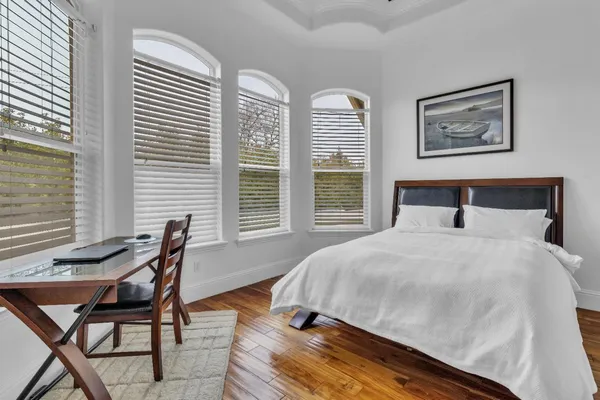 a bedroom with a bed and a view of bathroom