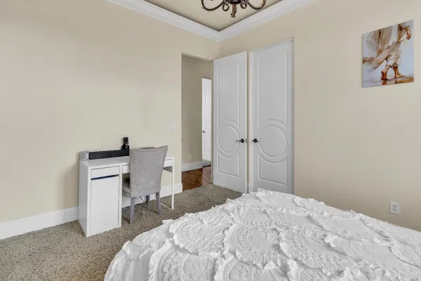 a kitchen with granite countertop a sink stove and cabinets