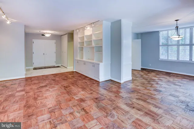 a kitchen with stainless steel appliances granite countertop a sink and a stove