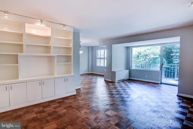 a kitchen with a sink appliances and cabinets