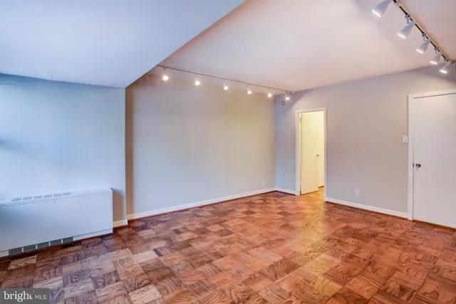 a bedroom with a bed and a bathroom