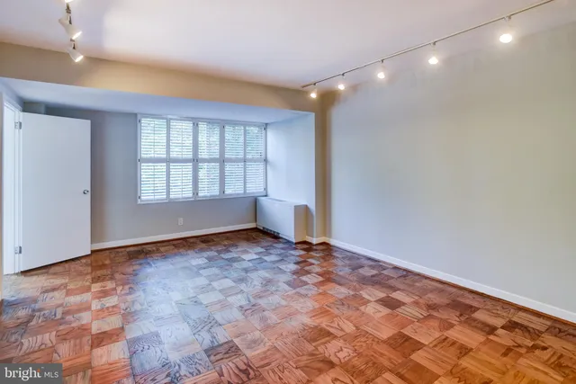 a bathroom with a sink toilet and mirror