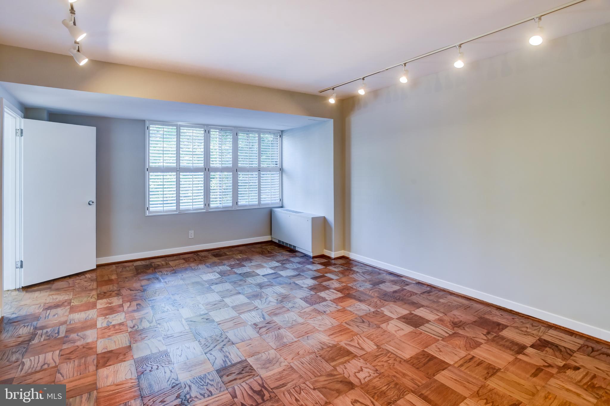 4100 Cathedral Avenue Northwest, Unit 512 Washington, DC 20016 - Photo 34 of 71 a view of an empty room and window